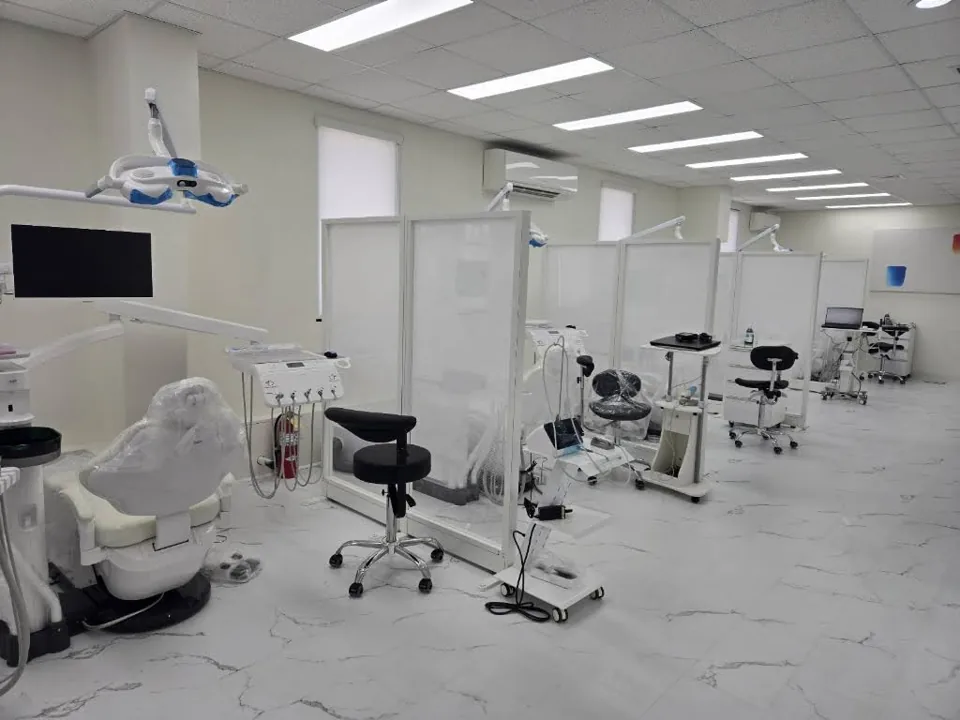 Sungshim Dental treatment area with dental chairs and partitions in Honolulu